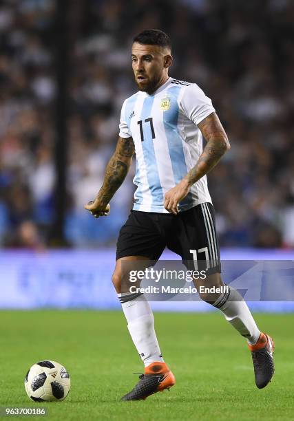 Nicolas Otamendi of Argentina drives the ball during an international friendly match between Argentina and Haiti at Alberto J. Armando Stadium on May...