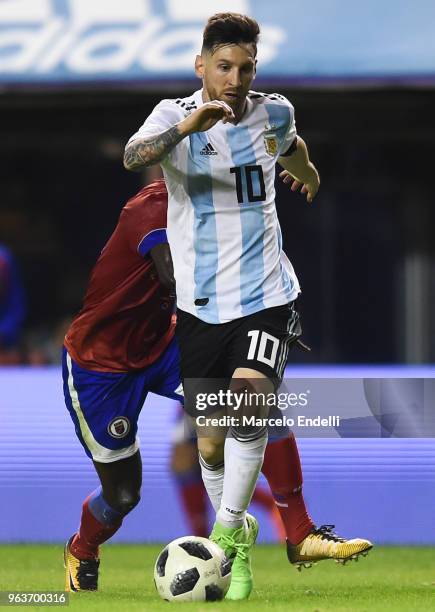 Lionel Messi of Argentina drives the ball during an international friendly match between Argentina and Haiti at Alberto J. Armando Stadium on May 29,...