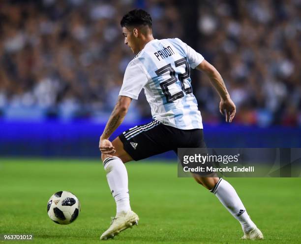 Cristian Pavon of Argentina drives the ball during an international friendly match between Argentina and Haiti at Alberto J. Armando Stadium on May...
