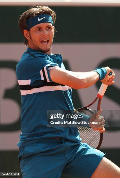 Jared Donaldson of The United States plays a forehand during the mens singles second round match against Grigor Dimitrov of Bulgaria during day four...