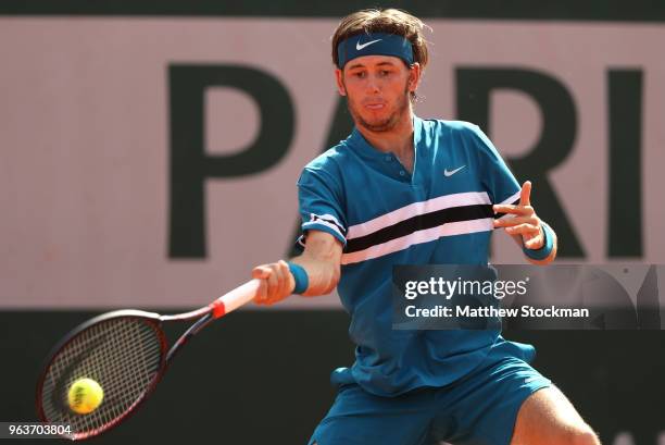 Jared Donaldson of The United States plays a forehand during the mens singles second round match against Grigor Dimitrov of Bulgaria during day four...