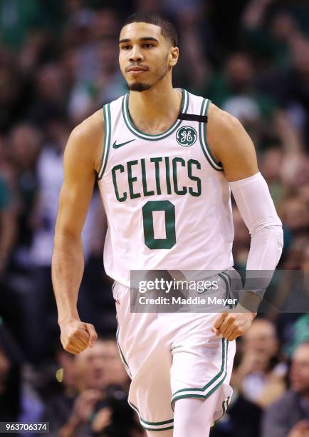 Jayson Tatum of the Boston Celtics celebrates after hitting a three point shot against the Cleveland Cavaliers during Game Seven of the 2018 NBA...