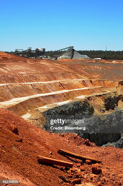 Crushed rock pile standing at the end of a conveyor belt can be seen beyond the southern pit mine at Newmont Mining Corp.'s Boddington Gold mine, in...