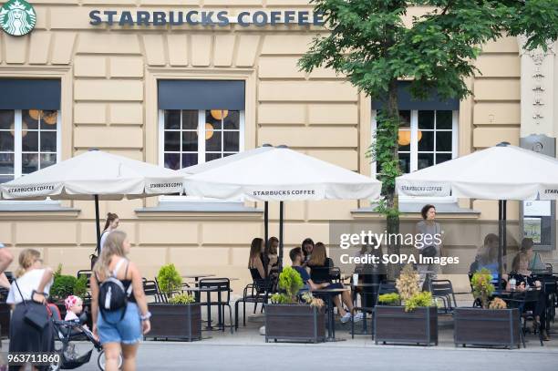 Costumers seen at a Starbucks Coffee in Krakow. American chain Starbucks closed more than 8,000 stores in the U.S.A on May 29 afternoon to provide...