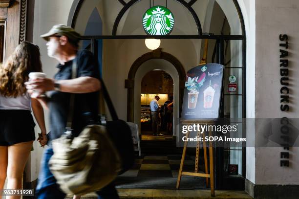 Man seen leaving from a Starbucks in Krakow. American chain Starbucks closed more than 8,000 stores in the U.S.A on May 29 afternoon to provide...