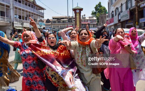Anganwadi rural mother and child care centre workers shout anti-government slogans during a demonstration against the government in city centre Lal...