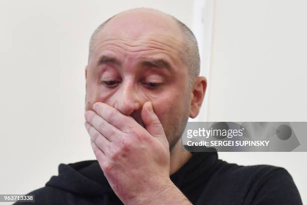 Russian anti-Kremlin journalist Arkady Babchenko reacts during a press conference at Ukrainian Security Service in Kiev on May 30, 2018. - Ukraine...