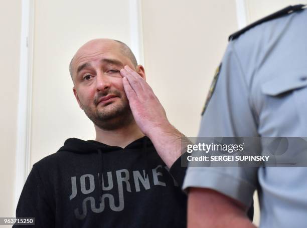 Russian anti-Kremlin journalist Arkady Babchenko reacts during a press conference at Ukrainian Security Service in Kiev on May 30, 2018. - Ukraine...