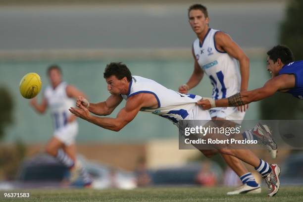 Brent Harvey handballs under pressure during a North Melbourne Kangaroos intra-club AFL match at Eureka Stadium on February 3, 2010 in Ballarat,...