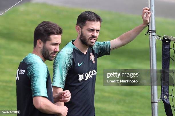 Portugal's forward Bernardo Silva and Portugal's midfielder Joao Moutinho during a training session at Cidade do Futebol training camp in Oeiras,...