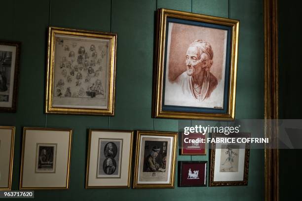 Picture shows gravures of French philosepher and writer Voltaire at the newly restored Chateau de Voltaire on May 30, 2018 in Ferney-Voltaire,...