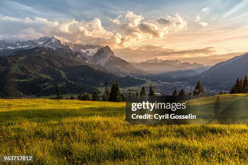 Sunset at a mountain pasture over Garmisch-Partenkirchen Sunset at a mountain pasture over Garmisch-Partenkirchen