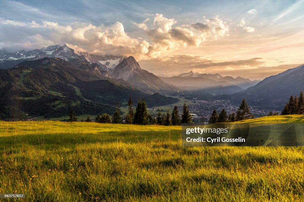 Sunset at a mountain pasture over Garmisch-Partenkirchen
