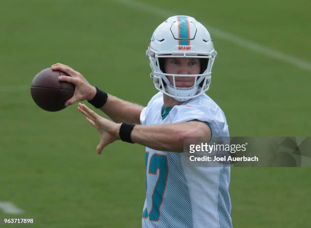 Ryan Tannehill of the Miami Dolphins throws the ball during the teams training camp on May 30, 2018 at the Miami Dolphins training facility in Davie,...