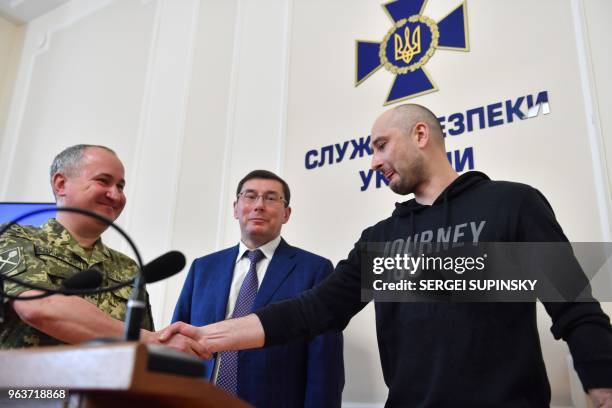 Anti-Kremlin Russian journalist Arkady Babchenko , head of Ukraine's security service Vasyl Grytsak and the Prosecutor General Yuri Lutsenko attend a...