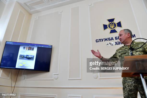Head of Ukraine's security service Vasyl Grytsak displays an operative video during a press conference at Ukrainian Security Service in Kiev on May...