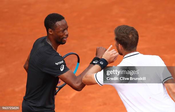 The match umpire speaks to Gael Monfils of France following an injury during his mens singles second round match against Martin Klizan of Slovakia...