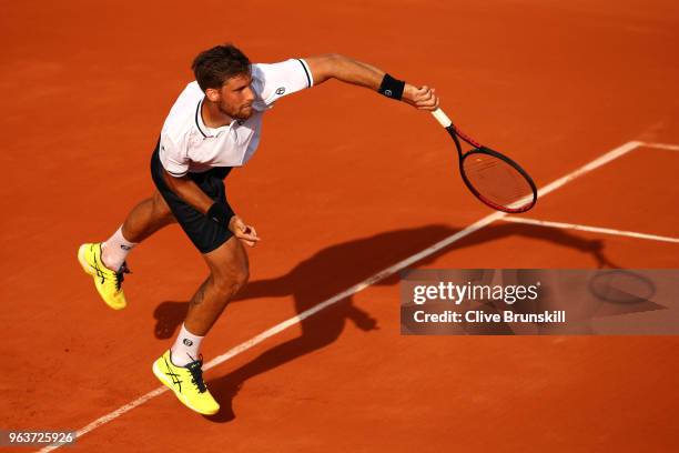 Martin Klizan of Slovakia serves during his mens singles second round match against Gael Monfils of France during day four of the 2018 French Open at...