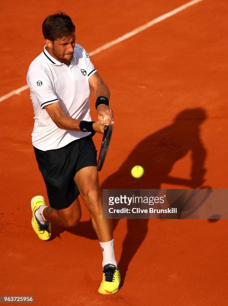Martin Klizan of Slovakia plays a backhand during his mens singles second round match against Gael Monfils of France during day four of the 2018...