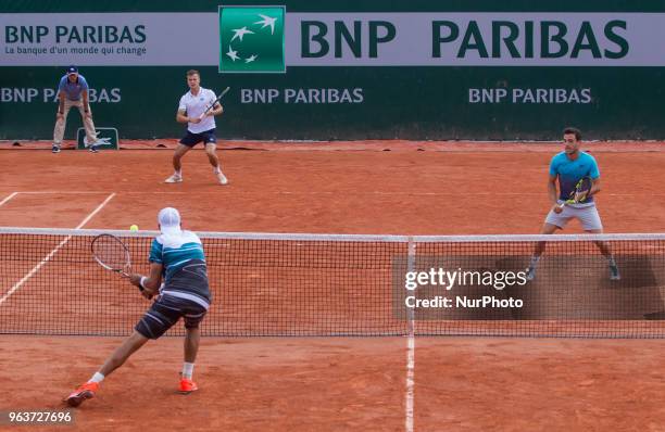 Lukasz Kubot of Poland and Marcelo Melo of Brazil returns the ball to Márton Fucsovics of Hungary and Marco Cecchinato of Italy during the second...