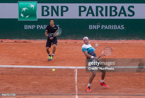 Lukasz Kubot of Poland and Marcelo Melo of Brazil returns the ball to Márton Fucsovics of Hungary and Marco Cecchinato of Italy during the second...