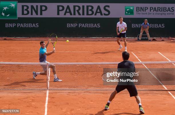 Márton Fucsovics of Hungary and Marco Cecchinato of Italy returns the ball to Lukasz Kubot of Poland and Marcelo Melo of Brazil during the second...