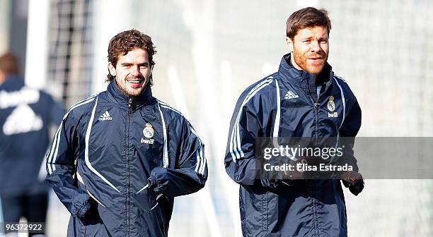 Fernando Gago and Xabi Alonso of Real Madrid run during a training session at Valdebebas on February 3, 2010 in Madrid, Spain. .