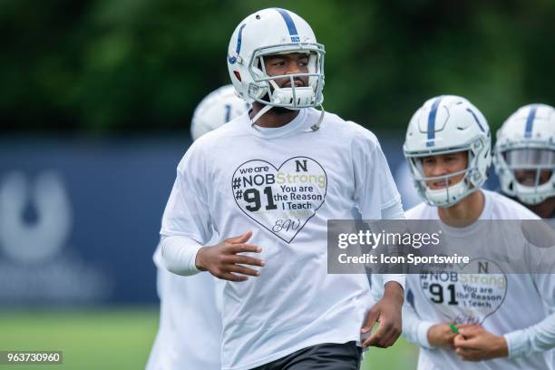 Indianapolis Colts quarterback Jacoby Brissett wears a shirt honoring Noblesville West Middle School science teacher Jason Seaman during the...