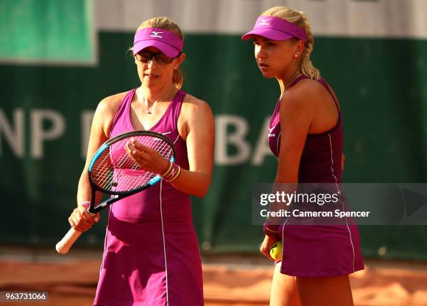 Anastasia Rodionova of Australia, speaks with her partner of Nadiia Kichenok of Ukraine during the ladies doubles first round match against Many...