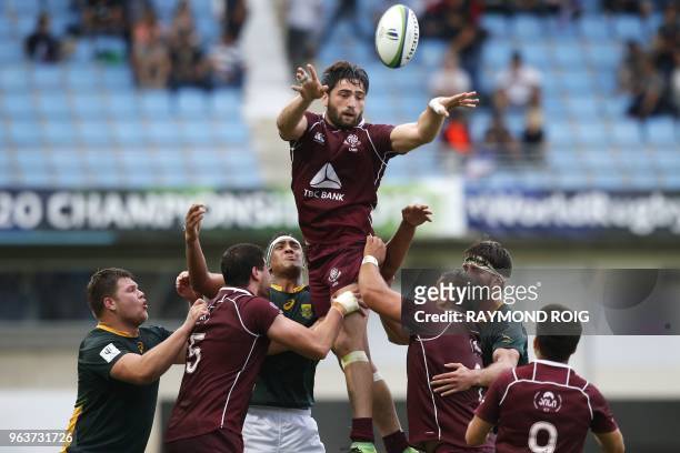 Georgia's lock Lasha Jaiani grabs the ball in a line-out during the 2018 World Rugby Under 20 Championship Pool C match between Georgia and South...