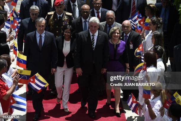 Cuban President Miguel Diaz-Canel , accompanied by his wife Liz Cuesta , Venezuelan Vice-President Tareck El Aissami and Venezuela's Constituent...