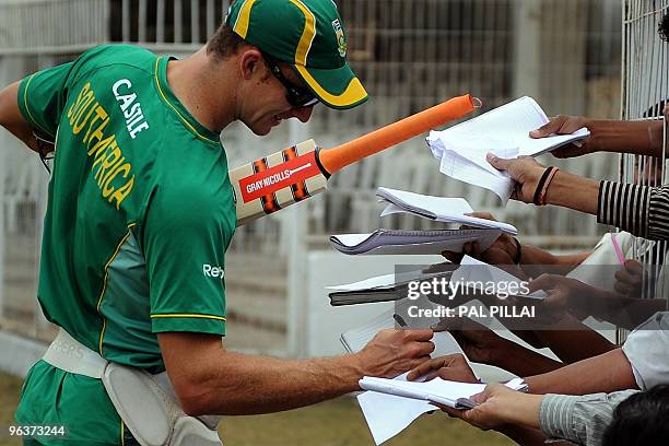 South African cricketer Ryan McLaren signs autographs on the second day of the two-day warmup match against Board President XI at Nagpur on February...