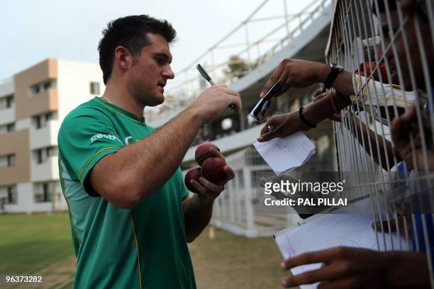 South African cricket captain Graeme Smith signs autographs on the second day of the two-day warmup match against Board President XI at Nagpur on...