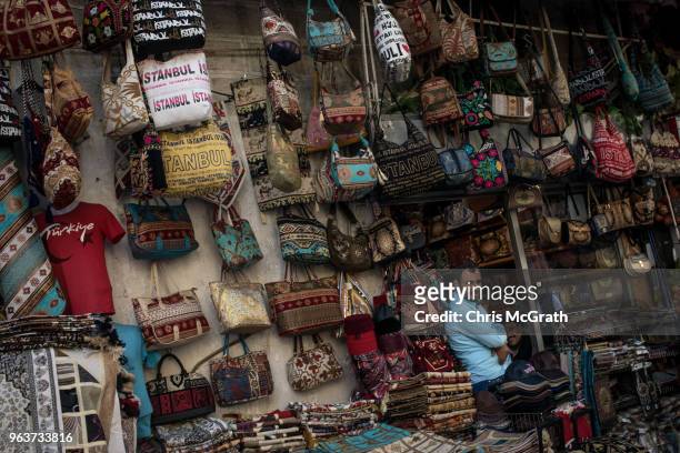 Shop owner waits for customers as people shop in Istanbul's famous Grand Bazaar on May 30, 2018 in Istanbul, Turkey. Fears are growing that Turkey's...
