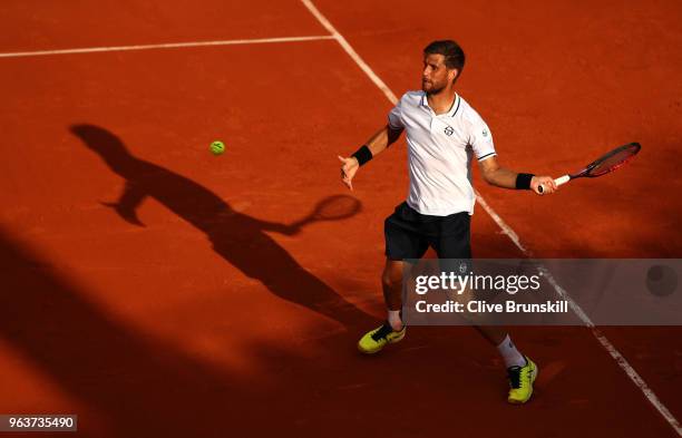 Martin Klizan of Slovakia plays a forehand during his mens singles second round match against Gael Monfils of France during day four of the 2018...