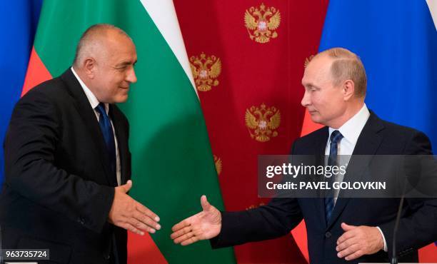 Russian President Vladimir Putin shakes hands with Bulgarian Prime Minister Boyko Borissov after their joint press conference following their talks...