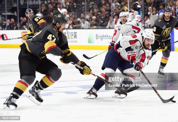 Luca Sbisa of the Vegas Golden Knights chases Chandler Stephenson of the Washington Capitals during the third period of Game One of the 2018 NHL...