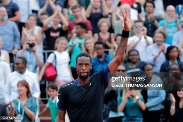 France's Gael Monfils celebrates after victory over Slovakia's Martin Klizan at the end of their men's singles second round match on day four of The...