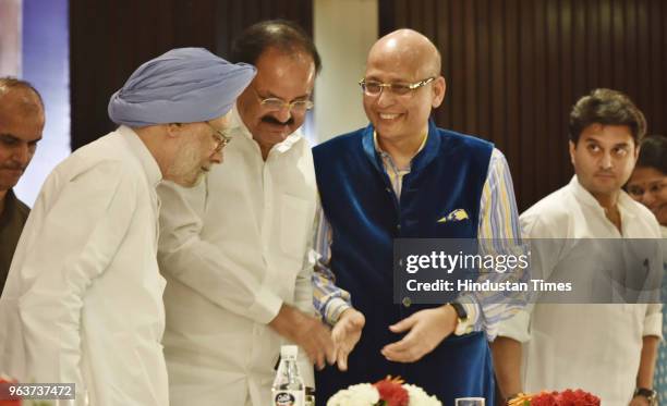 Former Prime Minister Manmohan Singh, Vice President of India M Venkaiah Naidu and Congress leader Abhishek Manu Singhvi enjoys a light moment as...