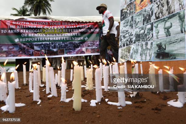 Banners and candles are displayed on May 30, 2018 at the Biafra district in Abidjan during a ceremony commemorating the Biafran War from 1967 to 1970.