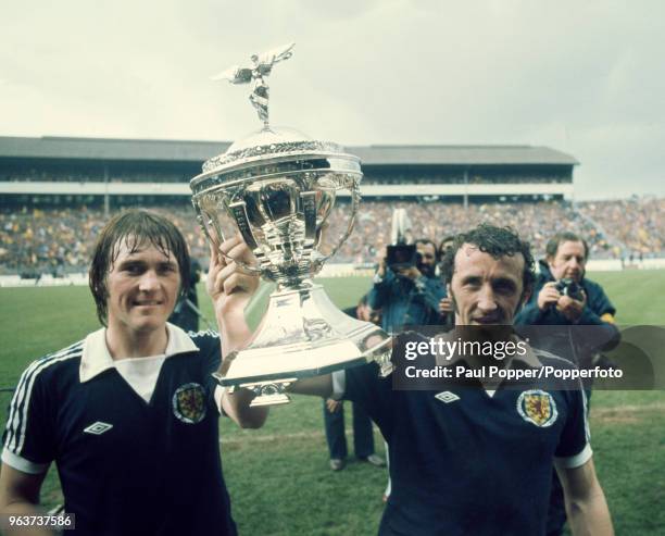 Kenny Dalglish and Danny McGrain of Scotland celebrate with the trophy after the British Home Championship match between Scotland and England at...