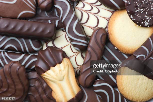 assortment of chocolate covered cookies - ogphoto stockfoto's en -beelden