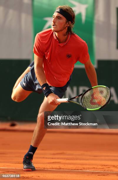 Stefanos Tsitsipas of Greece serves during the mens singles second round match against Dominic Thiem of Austria during day four of the 2018 French...