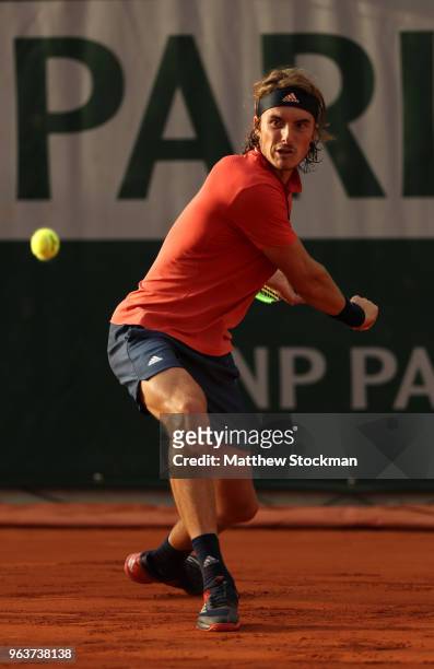 Stefanos Tsitsipas of Greece plays a backhand during the mens singles second round match against Dominic Thiem of Austria during day four of the 2018...