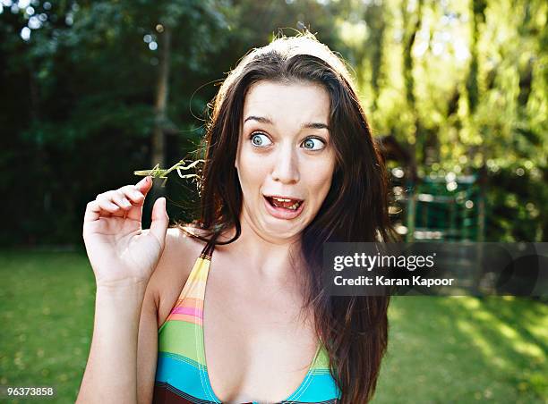 young femaile with insect (mantid) - facing fear foto e immagini stock