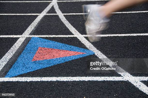 runner on a black track. - ogphoto stock pictures, royalty-free photos & images