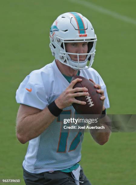 Ryan Tannehill of the Miami Dolphins drops back with the ball during the teams training camp on May 30, 2018 at the Miami Dolphins training facility...