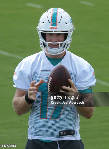 Ryan Tannehill of the Miami Dolphins rests between drills during the teams training camp on May 30, 2018 at the Miami Dolphins training facility in...