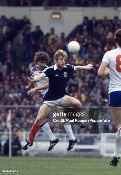 Bryan Robson of England and Steve Archibald of Scotland in action during a British Home Championship match at Wembley Stadium on May 23, 1981 in...