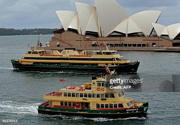 The Sydney Ferries Corporation Manly ferry the "Queenscliff" and the inner-harbour ferry "Borrowdale" pass each other on Sydney Harbour on February...